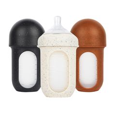 three different types of baby bottles are shown in this image, one is black, one is white