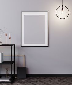 an empty frame hanging on the wall next to a shelf