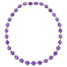 This striking and elegant necklace features luminous purple sapphires and glittering white diamonds. The thirty-one sapphires, totaling 47.52 carats, display a coveted lilac hue. The jewels are certified by C. Dunaigre as being all-natural, with no evidence of heat treatments to enhance the stones' lustrous color. Each sapphire is flanked by rose-cut diamonds, totaling 6.33 carats. The lustrous gems find harmony in their classic platinum setting. 16" length Lilac Sapphire, Sapphire Diamond Necklace, Purple Sapphire, Elegant Necklace, Modern Necklaces, Elegant Necklaces, Thirty One, Rose Cut Diamond, Sapphire Diamond