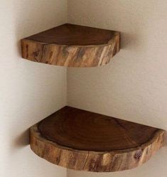 two wooden shelves in the corner of a room