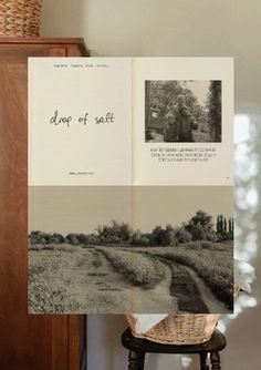 an open book sitting on top of a wooden table