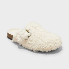 Comfy, cute and cozy, these Faux-Shearling Loafer Slippers from Cat & Jack™ add sweet style to your child's wardrobe. In a soft ivory hue, these slippers are made with plush faux shearling and a contoured footbed for all-day comfort. A closed-toe upper accented with a gold-tone buckle, plus slip-on style, complete the look. Cat & Jack™: Designed for all children so you can trust it's made for yours. Target Grocery, Construction For Kids, Slide Slippers, Clog Slippers, Loafer Slippers, Clog Sandals, Kids Fabric, Zipper Boots, Sweet Style