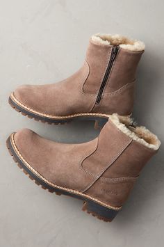 Cozy and classic, the cold-weather-ready Calib boots are a dream when the temps start to drop. Made of waterproof suede leather, these beautiful ankle boots protect you nicely from the elements, boasting plush shearling lining along the shaft and naturally insulating, breathable Merino wool lining at the foot. Pull them on or use the full inner zip—either way, you'll be immersed in softness and prepared for the first frost. With memory foam insoles and rubber lug outsoles. This boot has a genero Fleece Lined Boots Women, Slip On Boots Women, Sheep Skin Boots, Women’s Winter Boots, Chelsea Boots With Socks, Cute Winter Boots For Women, Waterproof Winter Boots Women, Elegant Winter Shoes, Cute Winter Shoes