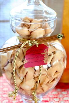 a glass jar filled with nuts and cinnamon sticks