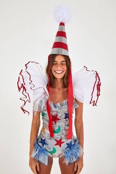 a woman wearing a costume and smiling for the camera