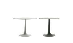 two white tables sitting next to each other