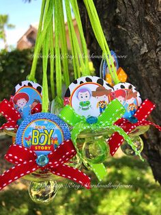 a bunch of little boy ornaments hanging from a tree