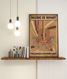 there is a music poster on the shelf next to some books and other things in front of it