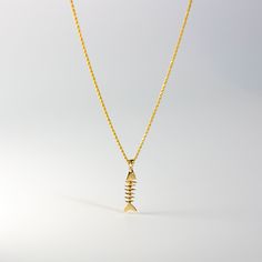 *The pendant COMES WITH the chain if you select one of our chain options *5% OFF TOTAL PRICE, when you purchase the chain and pendant combo (The price shown is after the discount) Cute and unique, you'll love this solid gold pendant as your unique gold pendant for casual day. Featuring a handmade and hand-polished fishbone, this 14K solid gold pendant is the perfect way to level up your day-to-day outfits. It's super casual yet unique and will make for a perfect conversation piece. Charlie & Co Unique Gold Pendant, Fish Bone Necklace, Bone Pendant, Bone Necklace, Statement Choker, Vintage Orange, Gold Copper, Beaded Choker Necklace, Necklace Charm