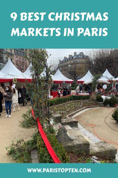 Christmas market stalls in Paris with festive decorations and visitors.