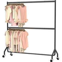 two racks with shirts hanging on them in front of a white wall and black wheels