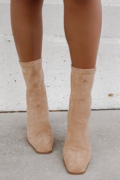 Sock style fitted ankle boot Shaped by a square toe. Back zipper closure. Lifted on a 4" block heel. Materials: Vegan Suede. This style runs true to size! This item is Final Sale. Beige Suede Ankle Boots, Nude Boots Outfit, Trending Womens Boots, Fall Boots For Women, Heels Classy Elegant, Fancy High Heels, Nude Boots, Elevated Fashion, Sock Style