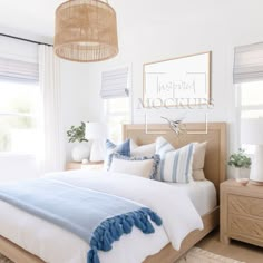 a bed with blue and white pillows in a bedroom