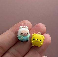 two small charms in the shape of animals