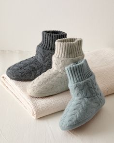 Crafted in cashmere inside and out, our soft yet structured slipper boots deliver cozy warmth up and over your ankles. Featuring cable-knit detail for stylish texture and a padded footbed for extra comfort.  Exclusive. Slip-on style.  Double-layer ribbed cuff.  Allover cable knit.  Padded footbed.  Man-made suede sole. Cozy Indoor Slippers, Cozy Slippers With Soft Texture And Round Toe, Winter Slippers With Soft Texture And Round Toe, Winter Comfortable Slippers With Soft Texture, Winter Loungewear Slippers With Round Toe, Winter Indoor Slippers With Soft Texture, Comfortable Winter Slippers With Soft Texture, Cozy Soft Slippers For Fall, Winter Loungewear Slippers With Textured Footbed