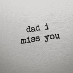 an old typewriter with the words dad i miss you printed on it's paper