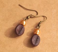 the earrings are made with wood and pearls