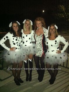 four women dressed up in costumes posing for the camera at an outdoor event with polka dots on their tutuses