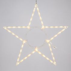 a lighted star hanging from the ceiling