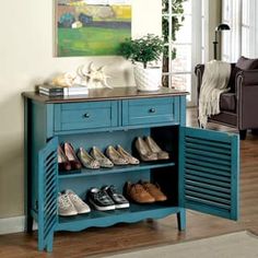 a blue cabinet with shoes on it in a living room