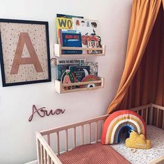 a baby's room with a crib and bookshelf