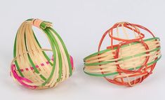 two baskets made out of bamboo and colored strips