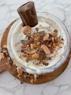 an ice cream sundae with chocolate and nuts on top