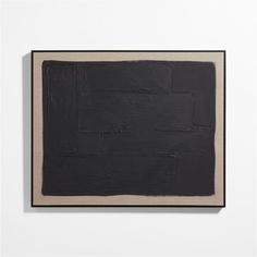 an abstract black and beige painting on a white wall