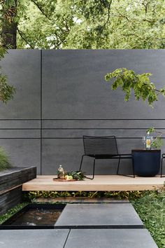 an outdoor seating area in the middle of a garden