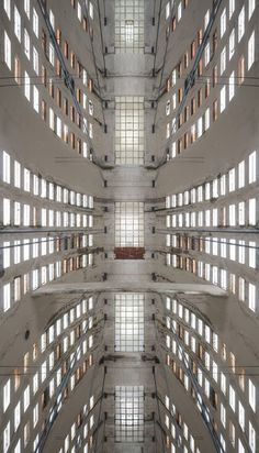 looking up at the ceiling and windows in a large building with many windows on each side