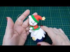 someone is making a christmas ornament out of clay