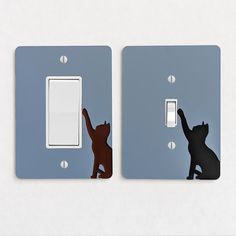 two light switch plates with cats on them