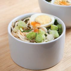 there is noodle soup with an egg in it