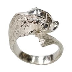 Sterling Silver "Fish" ring with a sapphire eyes, containing 2 round sapphires weighing .07pts. ring size is 6.25and can be size to fit for free. Sapphire Eyes, Fish Ring, Round Sapphire, Silver Fish, Fashion Rings, Jewelry Rings, Sapphire, Ring Size, For Free