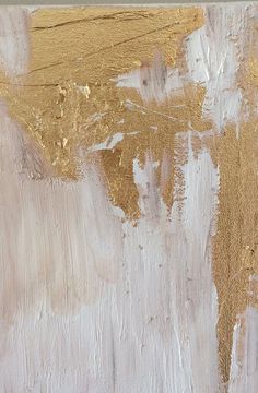 an abstract painting with gold and white paint