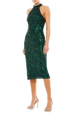 The most festive of frocks is rendered in a verdant hue, gridded with sequins and styled to show off your shoulders with alluring aplomb. 46" length Halter neck Sleeveless, with cutaway shoulders Lined 100% polyester Spot clean Imported Mac Duggal Dress, After Prom, Halter Cocktail Dress, Sparkle Skirt, Cocktail Dress Prom, Mac Duggal Dresses, Beaded Cocktail Dress, Semi Formal Dress, Western Chic