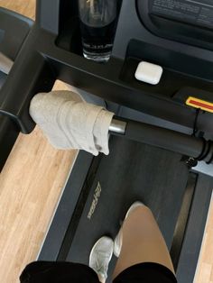 a person standing on a treadmill with their feet in the machine