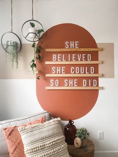 there is a sign on the wall that says she believed she could so she did