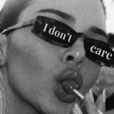 a woman with glasses that say i don't care