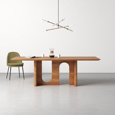 a dining table with two chairs and a chandelier hanging from the ceiling