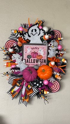 Fun and festive Ghostly Halloween Wreath,  Whimsical Wreath, Halloween Decor, Pink Halloween Wreath/Decor This is is a fun ghostly Halloween Wreath that is full of colorful picks, ribbon and bow to coordinate with it and also includes deco mesh.  This adorable wreath can be displayed both inside and outside.  To keep this wreath lasting as long as possible it is best to not display it in direct sunlight, damaging winds or heavy rains.  Expect normal wear and tear. Halloween Black Cat Wreaths, Cute Halloween Wreath, Pastel Halloween Wreath, Whimsical Wreath, Ghost Wreath, Gothic Stuff, Purple Wreath, Whimsical Wreaths, Whimsical Halloween