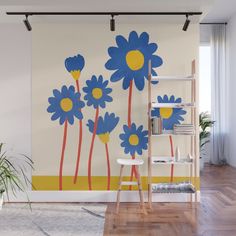 a wall mural with blue and yellow flowers on it's side in a living room