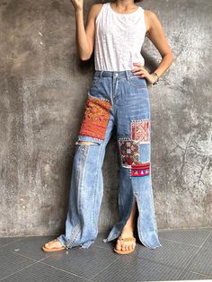 Remake Jeans with Ethnic Embroidered Patch, and decorated with Hmong style pins and Thai Dam Cloth. There are 2 Zippers on legs which can open and close.  It's unique Jeans Size : Waist 28 inch, Hips 38 inch, Length 40 inch (from the video, it's kindof loose for model, model's size it 32-26-36 and 5'5 tall) Patch On Jeans, Bohemian Jeans, Hmong Fashion, Unique Jeans, Retro Jeans, Visible Mending, Jean Large, Jean Vintage, Jeans Wide