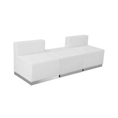 a white couch sitting on top of a white floor