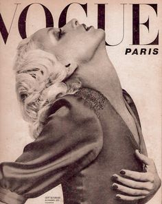 an old fashion magazine cover with a woman's face and hands on her chest