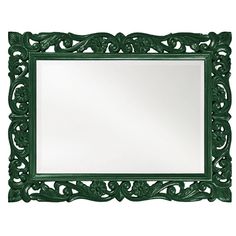 a green mirror sitting on top of a white wall