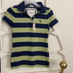 Brand New With Tags, Abercrombie & Fitch Polo Shirt, Colors Of Navy Blue And Green In Stripes. Womens Medium, 93% Cotton, 7% Elastane Exclusive Decoration. Striped Polo Shirt Outfit Women, 2000s Polo Shirt Outfit, Blue Fitted Collared T-shirt, Fitted Navy T-shirt For Spring, Green Striped Shirt, Polo Top, Swag Clothes, Polo Shirts, Abercrombie And Fitch