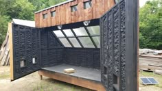 an outdoor area with a wooden structure and windows