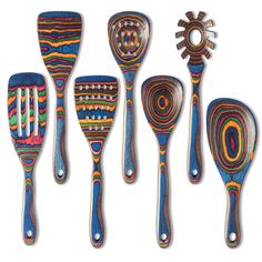 five spoons with different designs on them