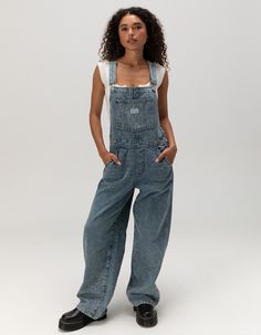 Levi's Premium Baggy Overalls. Everyday Overalls Meets The Perfect Loose Fit. Our Baggy Overalls Feature Classic Adjustable Straps, A Straight Leg Cut And Functional Pockets. Crafted With Classic Non-Stretch Denim. 5-Pocket Styling. Approx. Inseam: 30''. 95% Cotton, 5% Recycled Cotton. Machine Wash. Imported. Model Is Wearing A Size Small. Model Measurements:height: 5'7" Bust: 32cwaist: 24"hips: 35" | Levi's Premium Baggy Overalls - Lasting Imprint Overalls Straps Down, Women’s Jean Overalls, Baggy Denim Overalls, Levi’s Overalls, Women’s Overalls, Overalls Women Outfits, Oversize Overalls, Vintage Overalls Outfits, Jean Overalls Outfit